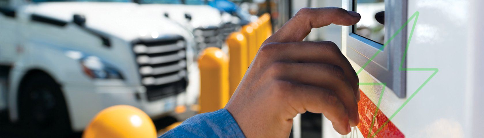 Finger touching a screen on an electric vehicle charging station