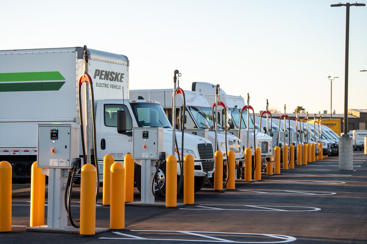 Penske Electric Vehicles at charging stations. 